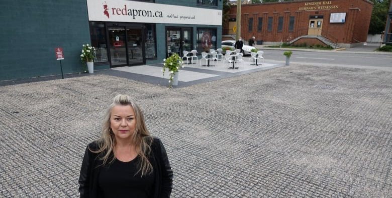 Red Apron co-owner Jennifer Heagle insisted on an ecologically sound alternative to asphalt for her parking lot, choosing to install a permeable surface. (Giacomo Panico/CBC)